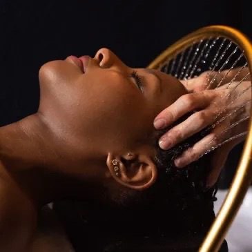 Hydro scalp water treatment in the wash basin at Body Roll Spa